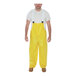 A man wearing yellow Tingley Webdri overalls.