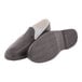 A pair of Tingley Weather Fashions black rubber moccasin overshoes with a white sole.