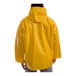 A person wearing a yellow Tingley American industrial rain jacket with a hood.