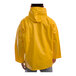 A person wearing a Tingley yellow industrial rain jacket with a hood.