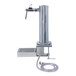A Micro Matic stainless steel draft tower with a silver metal tap and hose.