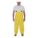 A man wearing yellow Tingley overalls.