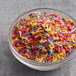 A bowl of India Tree Nature's Colors Fiesta Mix Sprinkles.