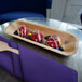 A VerTerra rectangular palm leaf tray with three round desserts on it.
