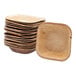 A stack of VerTerra square palm leaf plates on a white background.