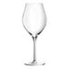 A close-up of a clear Chef & Sommelier wine glass with a stem.