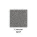 A close-up of a grey surface with the word "charcoal" in white.