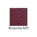 A close-up of a burgundy ASI Accurate Partitions urinal partition.