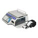 A white CAS CL-5500 series electronic scale with a screen and label printer.