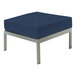 A Three Birds Casual Avanti navy blue square ottoman with metal legs.