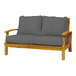 A Three Birds Casual Monterey wooden loveseat with grey cushions.