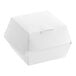 A white 4" x 4" x 3" paper clamshell take-out container with a lid.