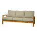 A Three Birds Casual Monterey wooden sofa with beige cushions on it.