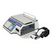 A white electronic CAS CL-5500 series bench scale with a label printer.