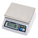 A white CAS digital portion scale on a counter.