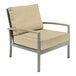 A Three Birds Casual Avanti Sand outdoor arm chair with a cushion on a metal frame.