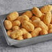 A tray of State Fair Classic Mini Corn Dogs on a table.