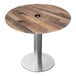 A round wooden table top with a brushed aluminum base.