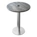 A round grey Holland Bar Stool EnduroTop table with a metal base and umbrella hole.