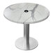 A round white marble Holland Bar Stool table with a brushed aluminum base.