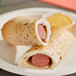 Two Clara's Kitchen beef bagel dogs wrapped in pastry.