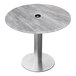 A Holland Bar EuroSlim round table with a brushed aluminum base and a greystone top.