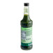 A green bottle of Monin Matcha Green Tea concentrate.