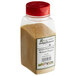 A clear plastic container of brown Regal Adobo Seasoning with a red lid.