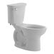 An American Standard white floor-mount chair height toilet with a silver handle.