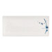 A rectangular white plate with blue designs.