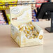 A case of Lindt Lindor White Chocolate Truffles on a counter.