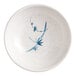 A white sauce dish with blue designs on it.