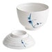 A white melamine bowl with blue bamboo design on the lid.