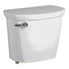 A white American Standard toilet tank with a lid and silver handle.