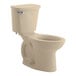 A bone American Standard Cadet PRO chair height toilet with a lid.