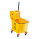 A yellow Lavex mop bucket with a handle.