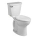 An American Standard white toilet with the seat down and a silver handle.