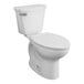 An American Standard white toilet with a seat lid.