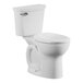 A white American Standard Cadet PRO chair height toilet with the seat down and a silver handle.