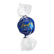 A Lindt Lindor dark chocolate ball in a blue and white plastic wrapper.