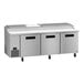 A stainless steel Hoshizaki refrigerated pizza prep table with three doors.
