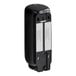 A black Tork wall-mount automatic soap dispenser with a white label.