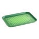 A white rectangular tray with a green football field design.