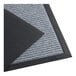 A close-up of a gray Lavex Needle Rib entrance mat with a gray stripe.