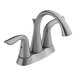 A stainless steel Delta deck-mount faucet with two lever handles.
