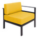 A BFM Seating Belmar yellow cushioned left arm chair with black frame.