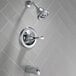 The chrome Delta T-Series bath and shower trim kit with a close-up of a handle.
