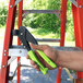 A hand using a Surebonder heavy-duty rivet tool.