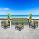 A BFM Seating Belmar outdoor patio set with black frames and green cushions.