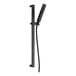 A matte black Delta handheld shower on a black metal slide bar pole.